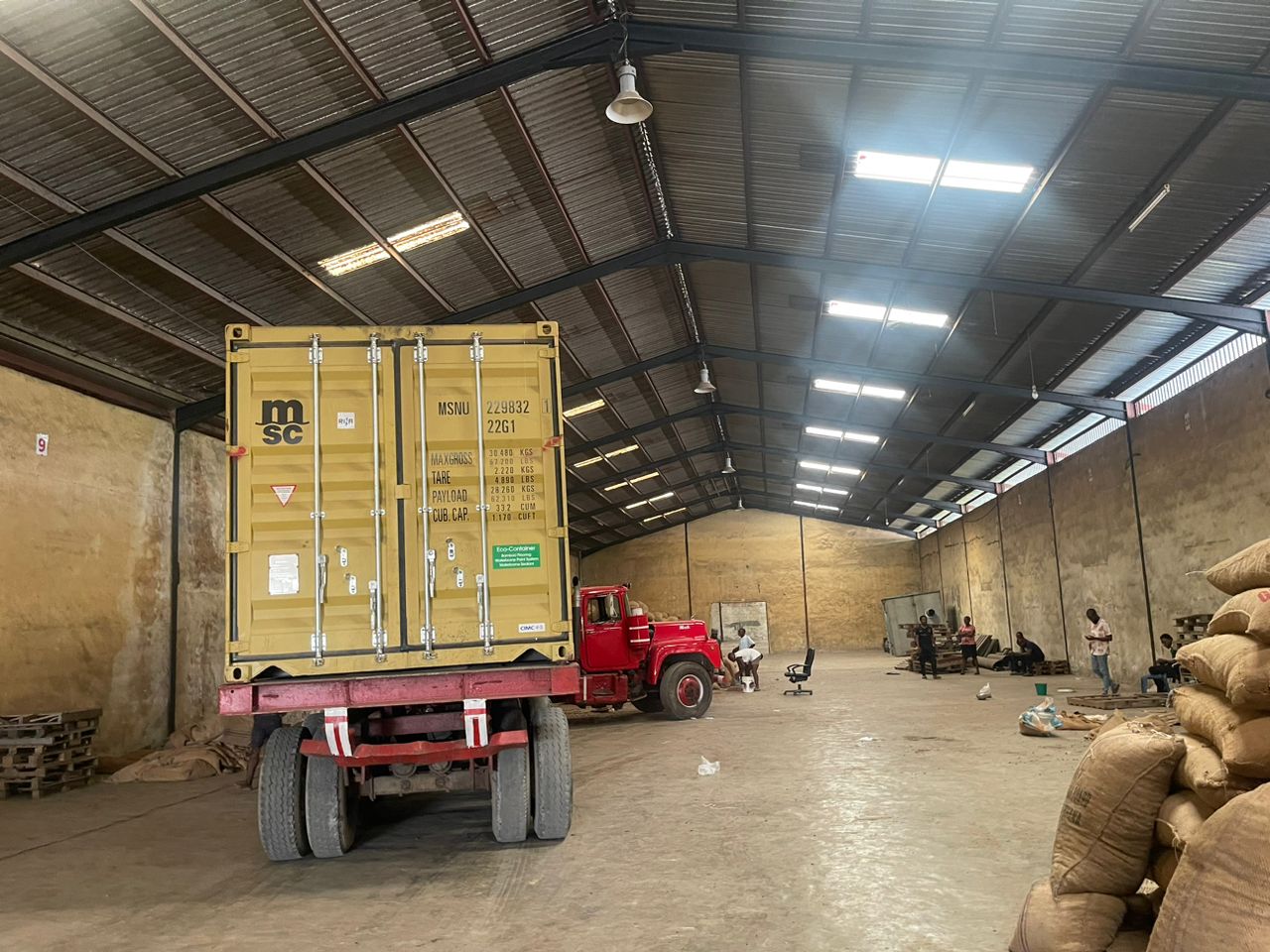 Export container being loaded at the warehouse